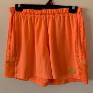 Bright orange athletic adidas shorts